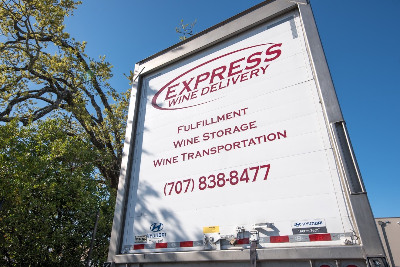 Back of truck with Express Wine Delivery logo on it